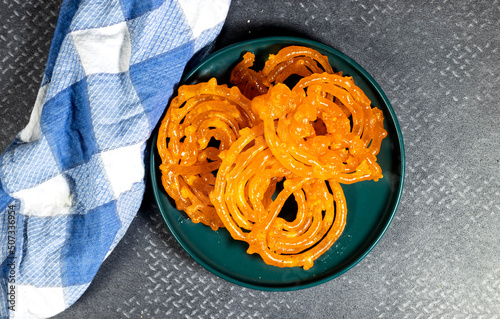 algeria sweet food named zlabi, in Inde named Jalebi, it is prepared with flour and yogurt and honey and other ingredients photo