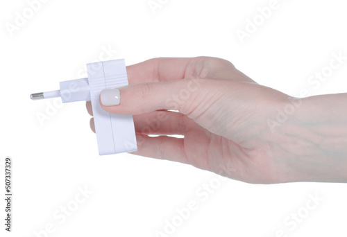 White USB charger in hand on white background isolation