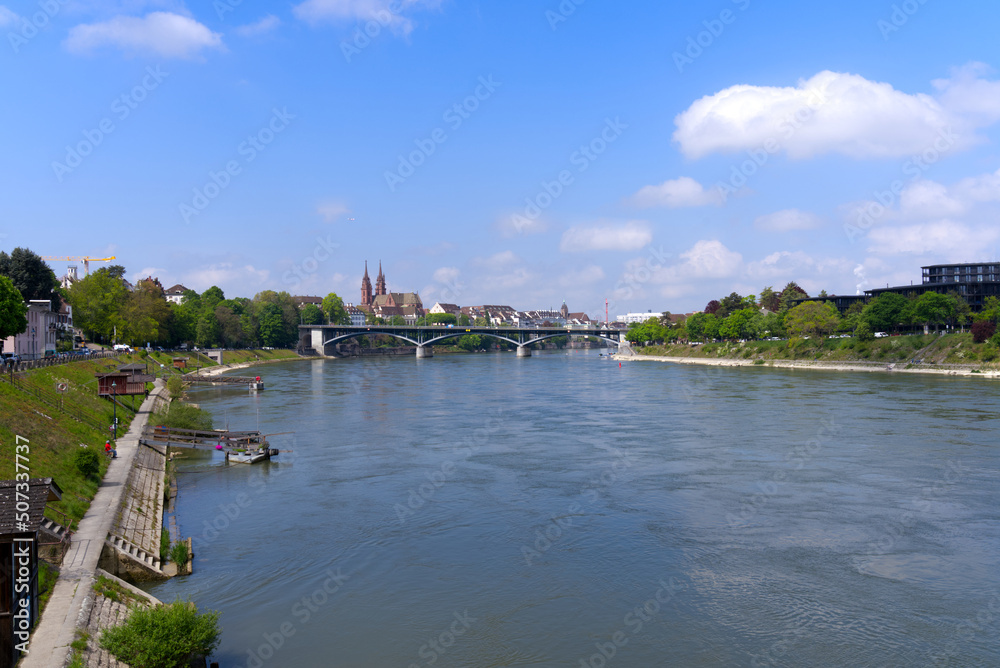 Scenic landscape with Rhine River at City of Basel on a blue cloudy spring day. Photo taken April 27th, 2022, Basel, Switzerland.