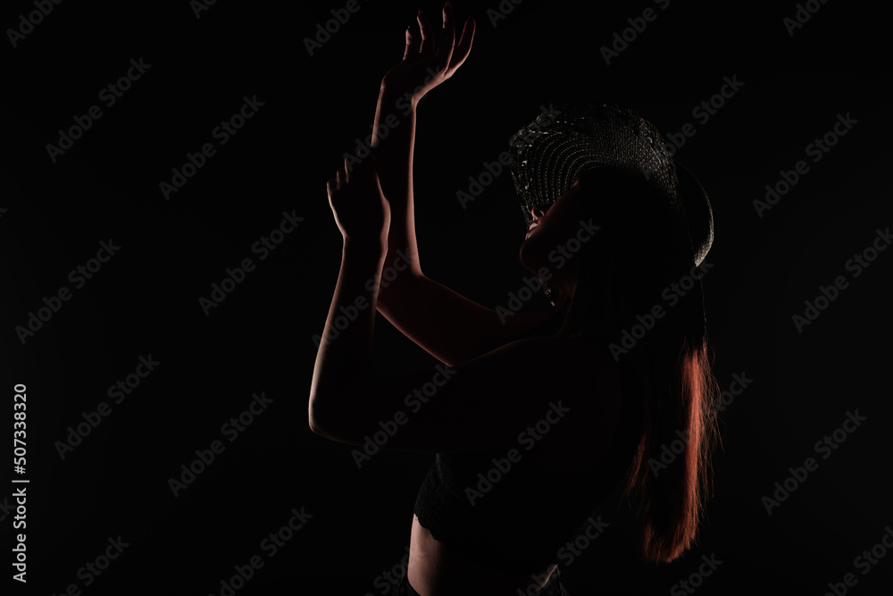 Posing and being seductive in studio, silhouette close up