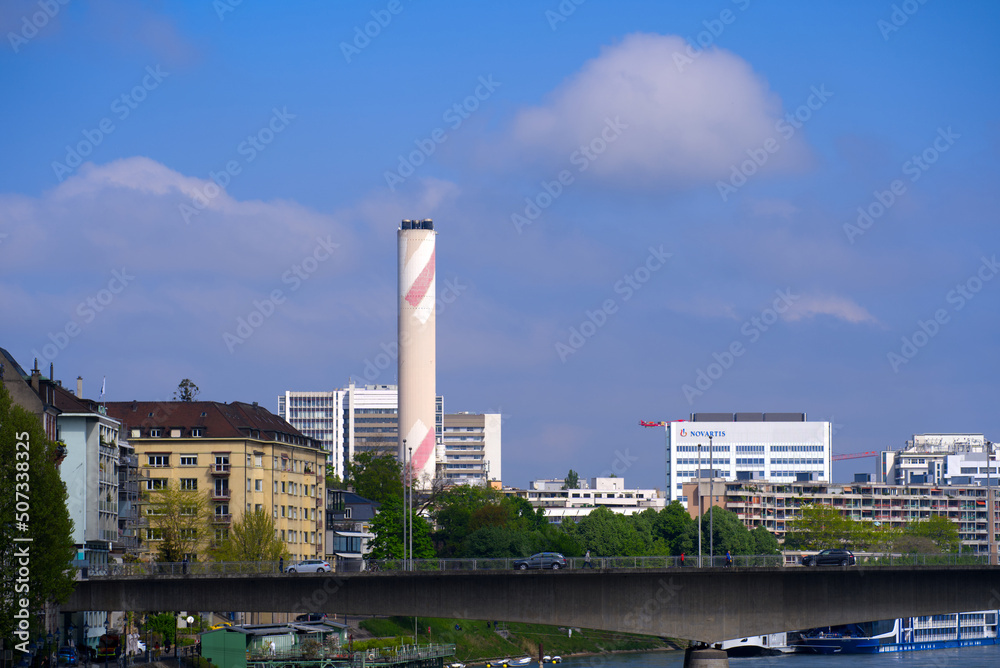 Skyline of City of Basel with Rhine River and Johanniter Bridge on a blue cloudy spring day. Photo taken April 27th, 2022, Basel, Switzerland.
