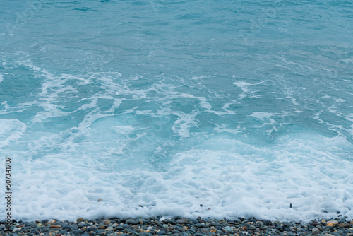 Waves crashing on the pebbled coast, the seaside of Qixingtan in Hualien, Taiwan