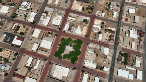 Aerial Lamesa Texas county office business climb. Rural central Texas oil field town. County government. Old historic downtown, city square center town. Green trees in park. Business. photo