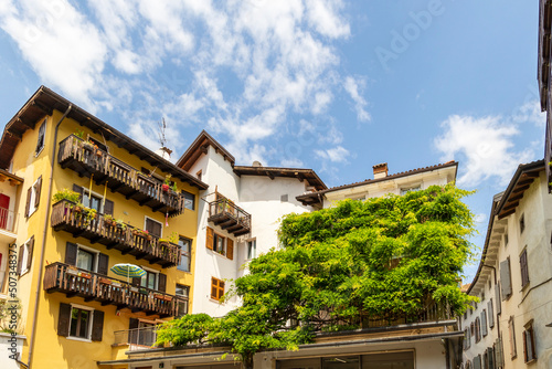 Residential houses in the Italian town of Arco on Lake Garda under blue sky and light clouds