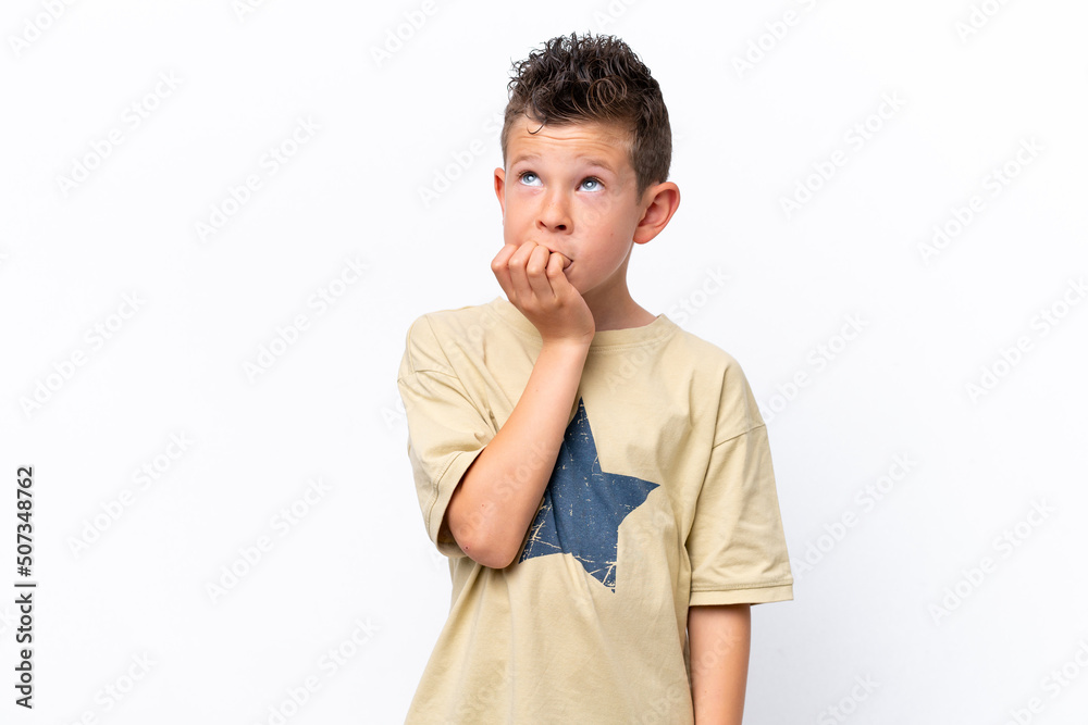 Little caucasian boy isolated on white background is a little bit nervous Little caucasian boy isolated on white background is a little bit nervous
