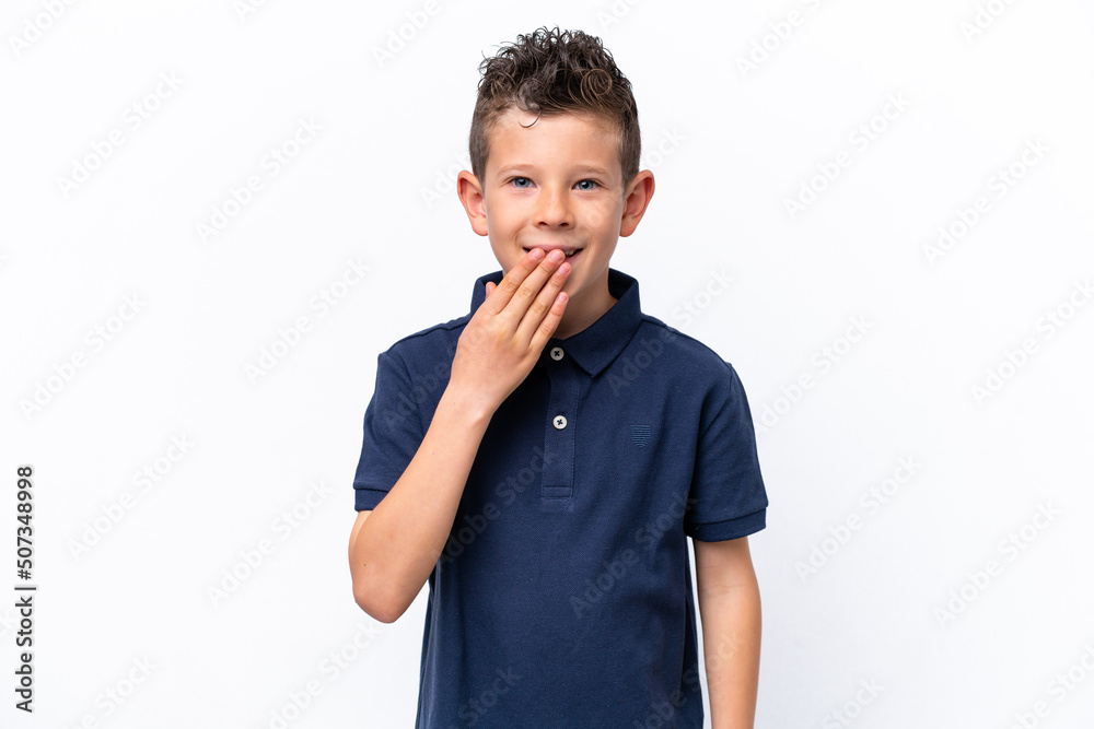 Little caucasian boy isolated on white background happy and smiling covering mouth with hand Little caucasian boy isolated on white background happy and smiling covering mouth with hand