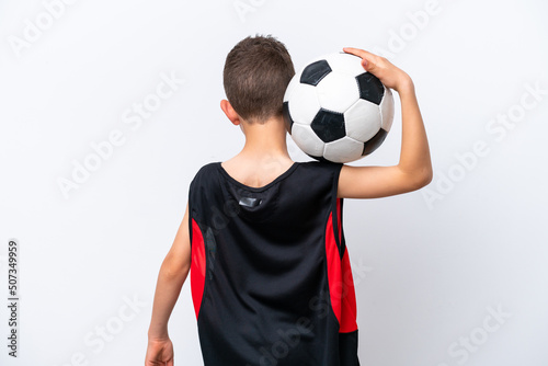 Little caucasian boy isolated on white background with soccer ball