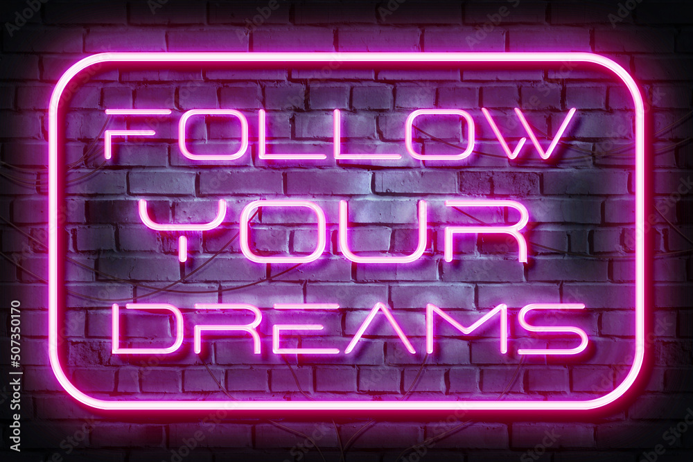 Follow Your Dreams Neon Sign on a Dark Brick Wall Follow Your Dreams Neon Sign on a Dark Brick Wall