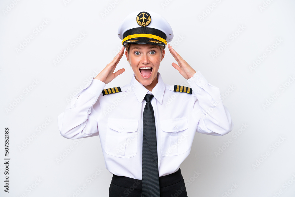 Airplane caucasian pilot woman isolated on white background with surprise expression Airplane caucasian pilot woman isolated on white background with surprise expression