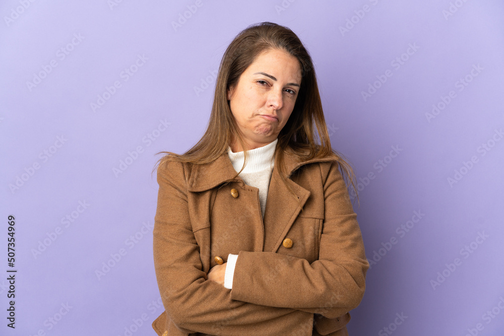 Middle age Brazilian woman isolated on purple background feeling upset Middle age Brazilian woman isolated on purple background feeling upset