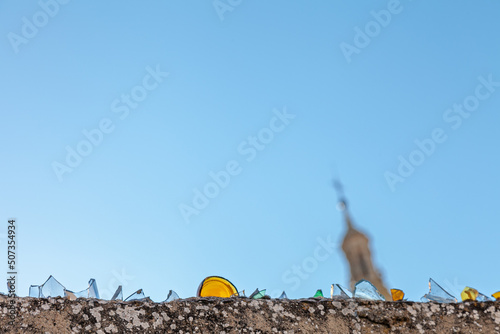 Photography a glass fence protects access to the grounds of a spanish catholic cathedral