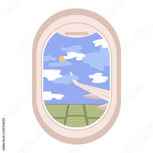 View through the porthole of aircraft. Airplane window. Clouds, fields and plane wing skyscape through porthole.