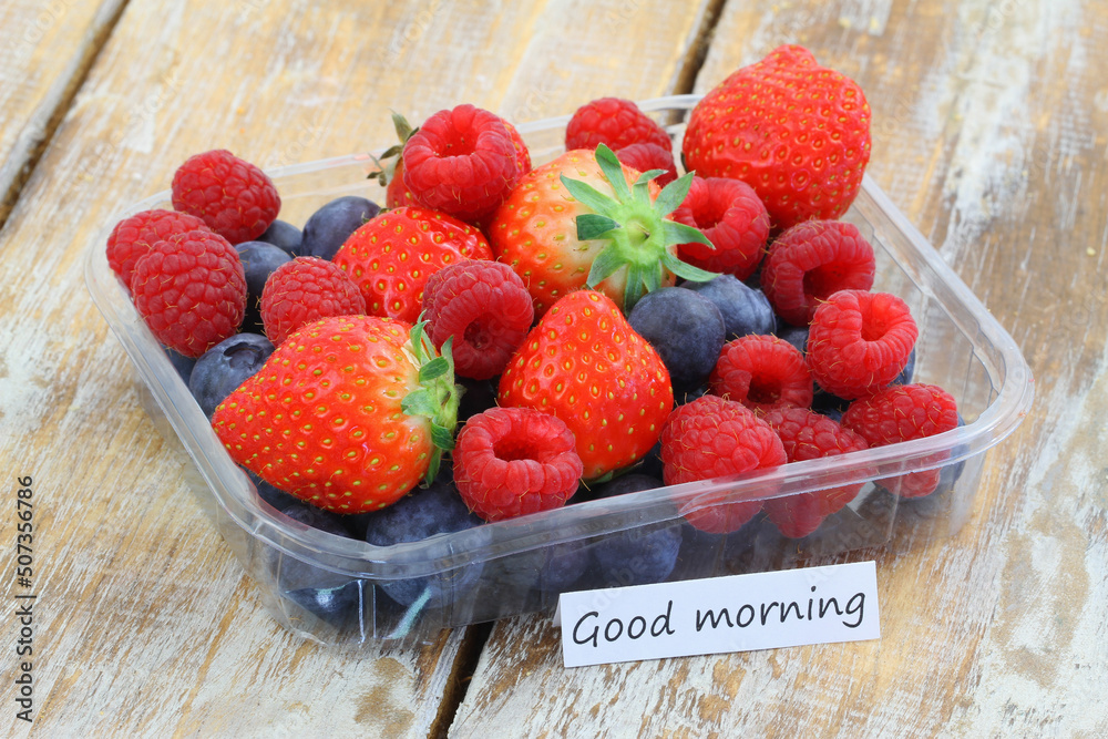 Good morning card with transparent box full of fresh fruit: strawberries, raspberries, blueberries