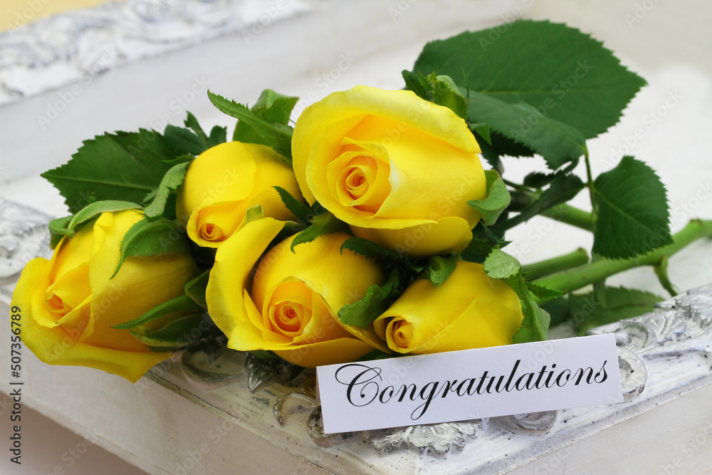 Congratulations card with five beautiful yellow roses on vintage white tray