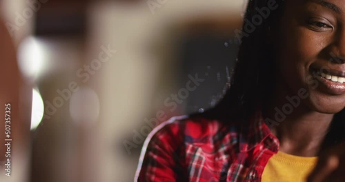 4K Beautiful girl relaxing at home at night & texting on her smartphone