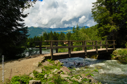 wooden bridge over the stream on Dolomites, Italy