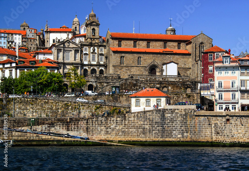 View of the historic part of Porto with its stone buildings and the river Douro on a sunny summer day in northern Portugal