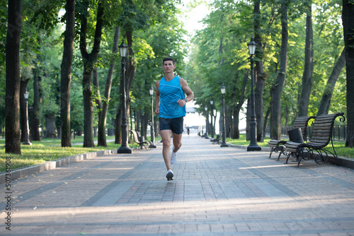 healthy athletic man runner running in sportswear outdoor