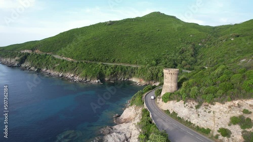 tour génoise au bord de la mer avec la route et une voiture - Cap Corse photo