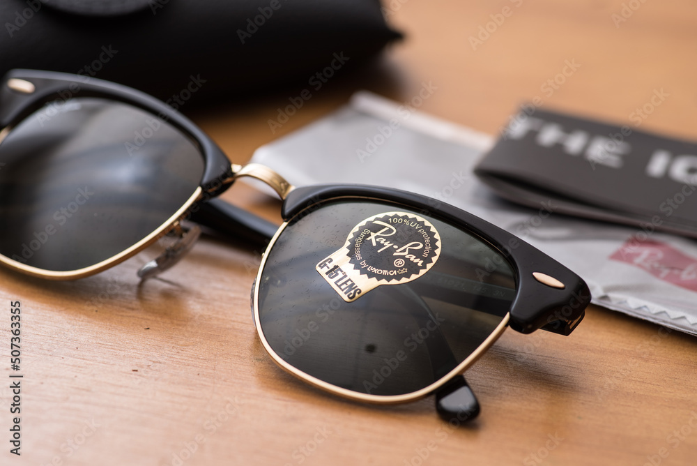Ray-Ban Black Clubmaster with Gold frame and classic G-15 Lens. Ray-Ban is  a brand of sunglasses and eyeglasses founded in 1937 by American company  Bausch & Lomb. Stock Photo | Adobe Stock