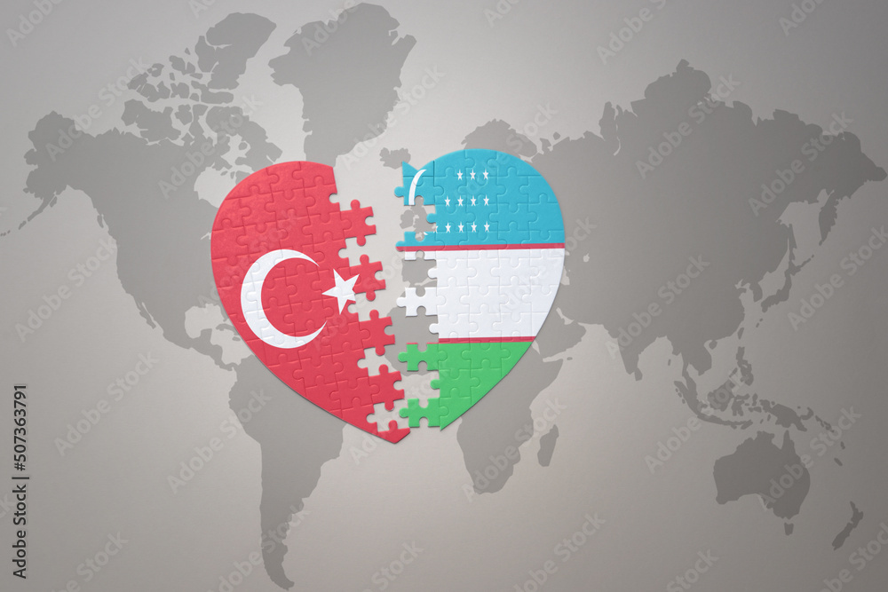 puzzle heart with the national flag of turkey and uzbekistan on a world map background. Concept.