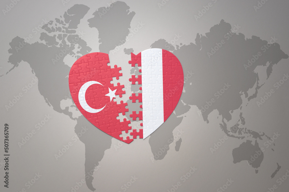 Fototapeta premium puzzle heart with the national flag of turkey and peru on a world map background. Concept.