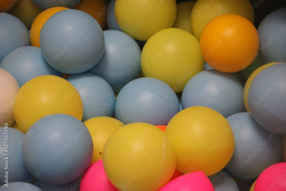 Plastic balls in colors of blue, red, green, yellow and orange Plastic balls in colors of blue, red, green, yellow and orange