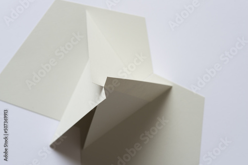gray paper shapes on a light background (3d)