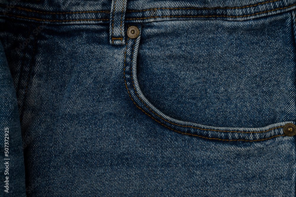 Blue jeans front pocket, old jeans close up Blue jeans front pocket, old jeans close up