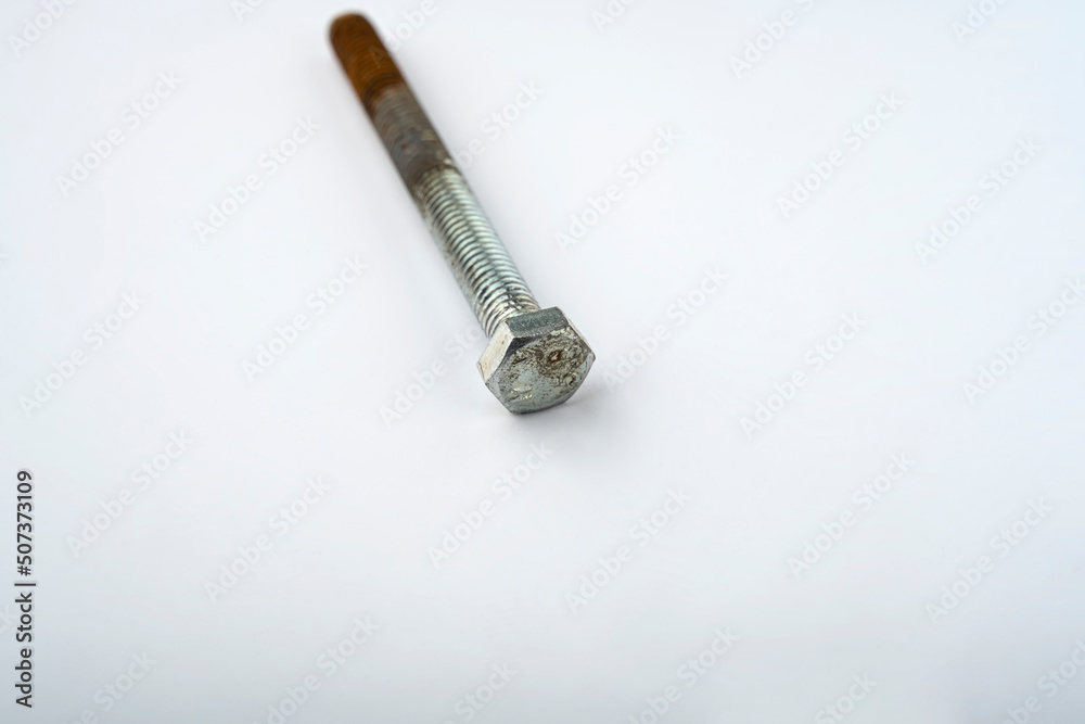 Bolt on the table. Screw on. Bolt isolated on white background Bolt on the table. Screw on. Bolt isolated on white background