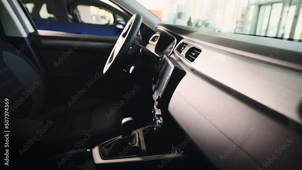 The interior of a new car in the showroom for sale. Car dealer showroom. The interior of a new car in the showroom for sale. Car dealer showroom.