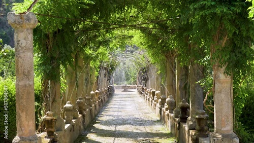 Alley with water fountain in the Alfabia gardens and nature park in the Tramuntana mountain - Bunyola, Mallorca, Balearic Islands, Spain