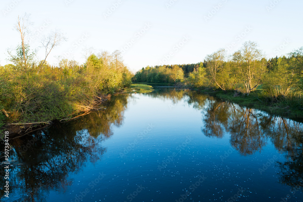 High angle view to a beautiful river landscape on a late spring morning in Estonia, Northern Europe High angle view to a beautiful river landscape on a late spring morning in Estonia, Northern Europe