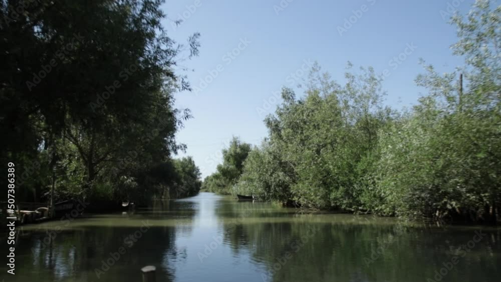Beautiful view on river and green nature with blue sky from the motor boat seat. Speedboat floating on water, summer vacation, tourism Beautiful view on river and green nature with blue sky from the motor boat seat. Speedboat floating on water, summer vacation, tourism