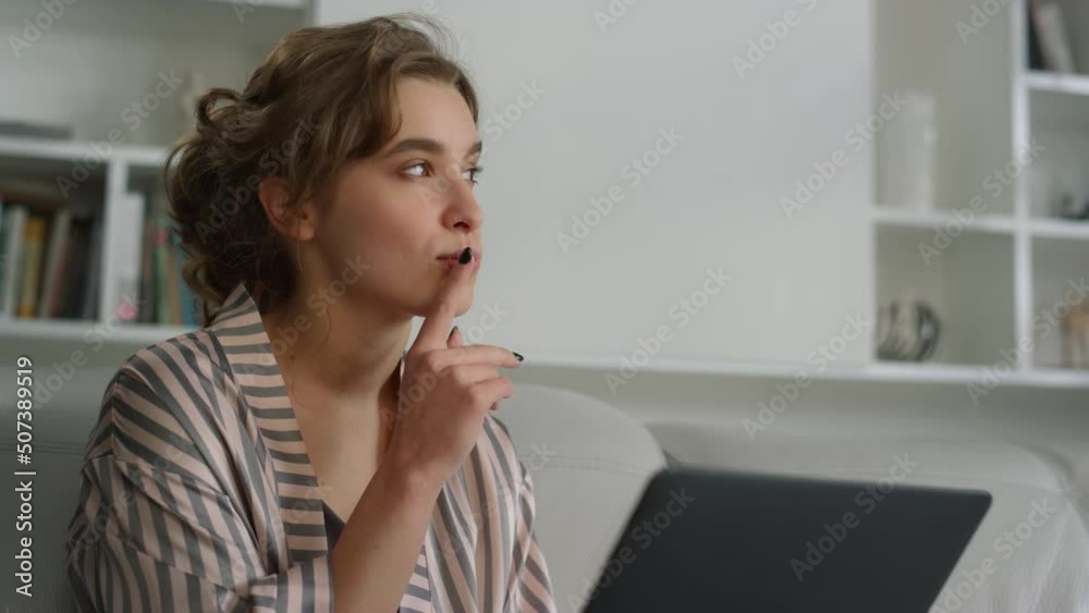Thoughtful student pondering question studying online at home office closeup. Thoughtful student pondering question studying online at home office closeup.