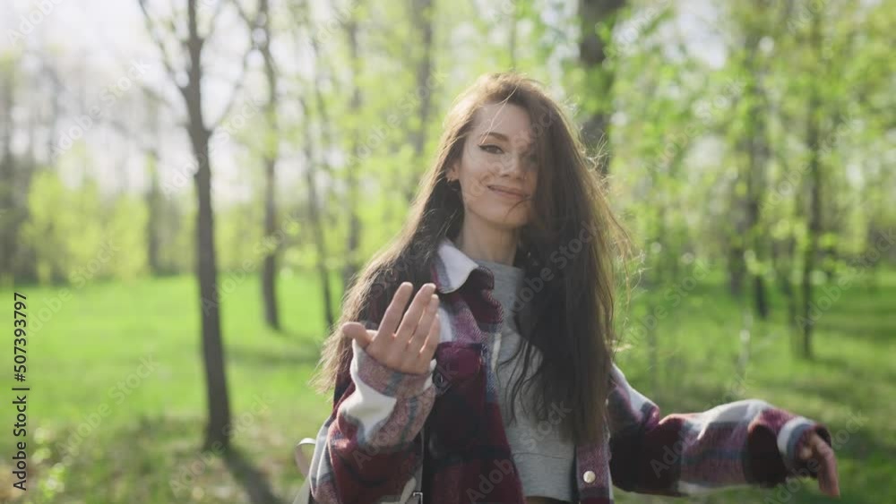 Romantic concept, follow me. A playful young and beautiful woman beckons her boyfriend. Romantic concept, follow me. A playful young and beautiful woman beckons her boyfriend.