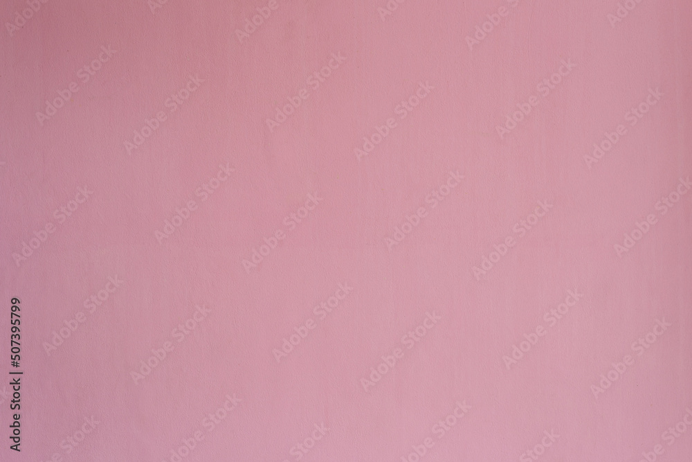 Pink color with an old grunge wall concrete texture as a background. Pink color with an old grunge wall concrete texture as a background.