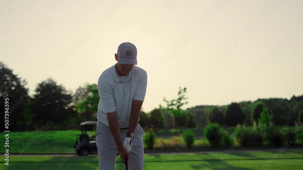 Professional golfer hitting ball on fairway game. Pensioner spend time outdoors. Professional golfer hitting ball on fairway game. Pensioner spend time outdoors.