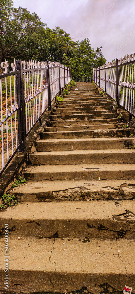Bangalore, India 2022: Vacant broken stairs surrounded by iron rail