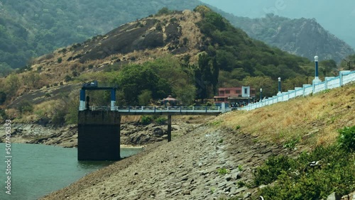 Scenic view of majestic Anamalai Hills of the Western Ghats, Tamil Nadu shot from the corridor/reservoir road of a dam in southern India in bright daylight.  photo