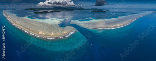 Ariel shot of small boat at coral reef, Kepidauen Mwand, pohnpei, Micronesia