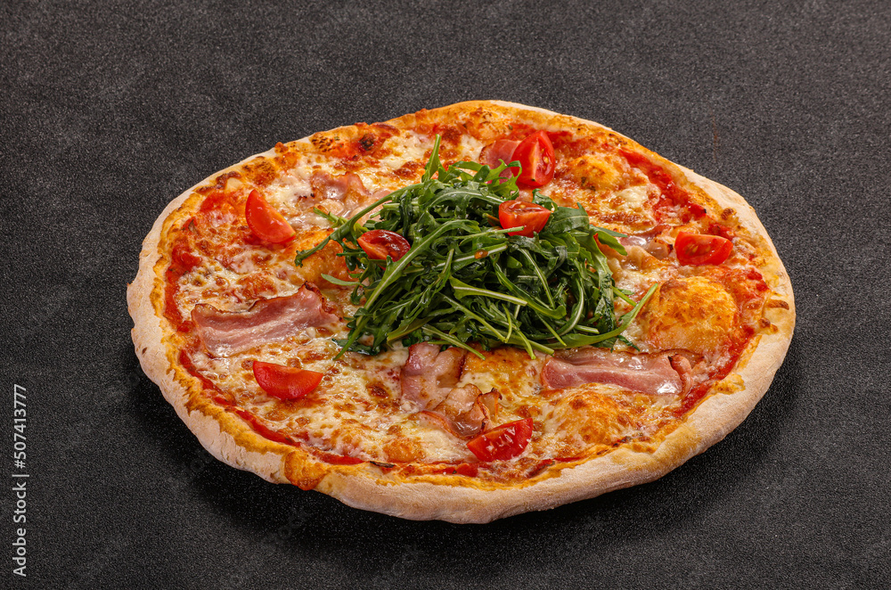 Pizza with bacon and rucola