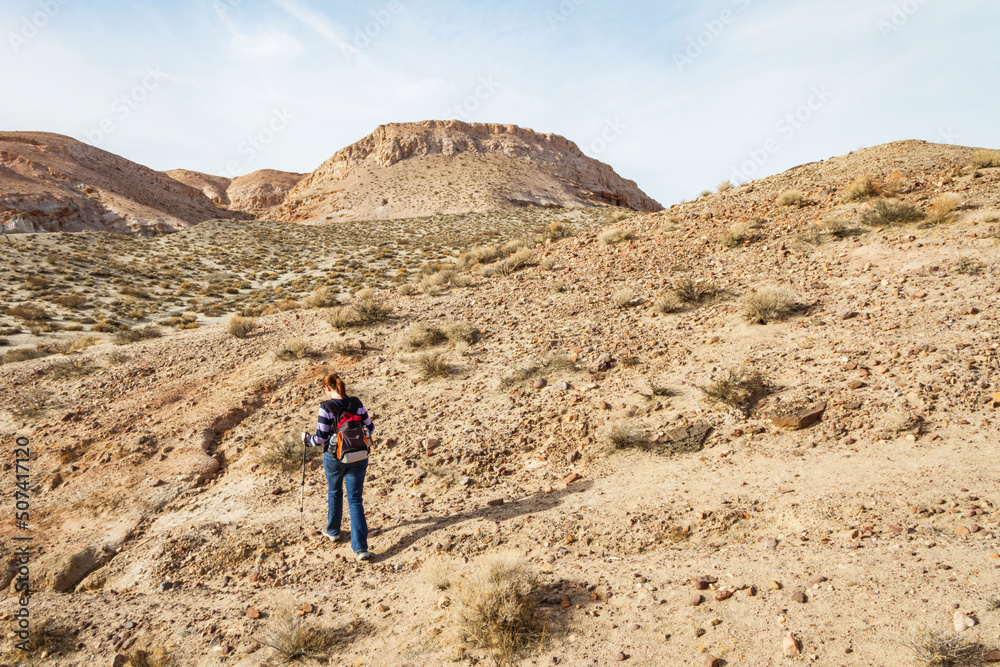 A Woman Hikes Through Red Rock Canyon in Southern California