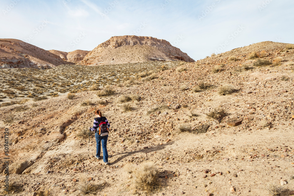 A Woman Hikes Through Red Rock Canyon in Southern California A Woman Hikes Through Red Rock Canyon in Southern California