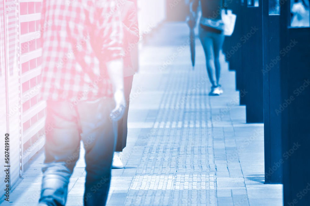 Fototapeta premium people walking on the street