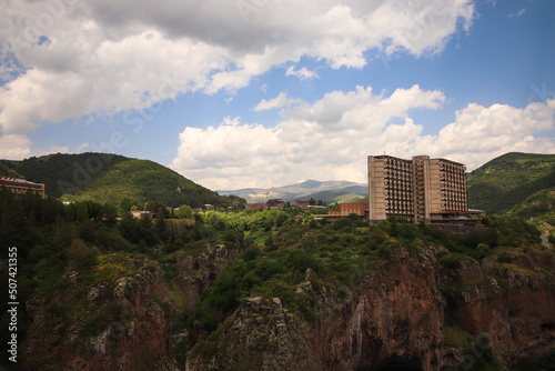 Two hotel buildings on the edge of a mountain photo