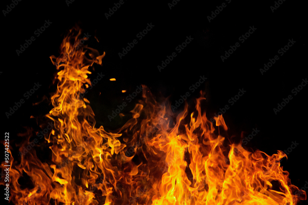 Close up burning flames on black background for graphic design or wallpaper