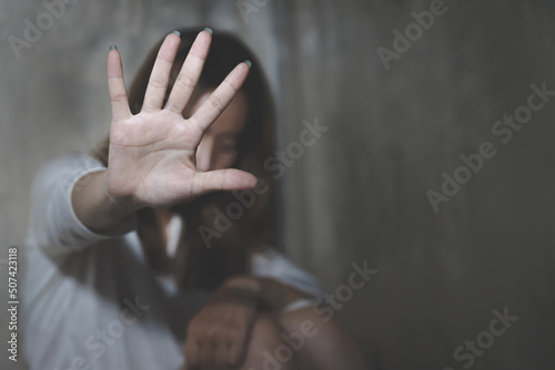 The girl raised her hand to stop. Defending herself with her hand. end violence against women Campaign against rape and human trafficking. Claim women's rights and liberties.