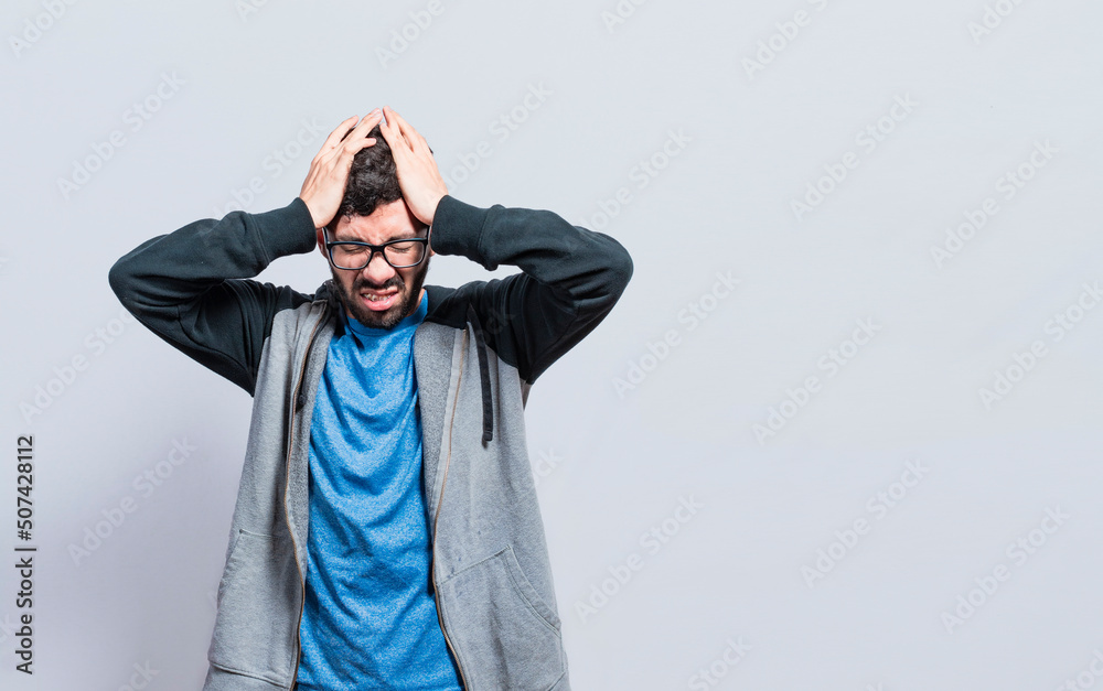 People rubbing his head on isolated background, Concept of a person with a headache, guy giving himself a head massage, concept of a man with a migraine People rubbing his head on isolated background, Concept of a person with a headache, guy giving himself a head massage, concept of a man with a migraine
