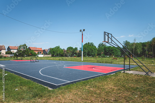 new outdoor basketball court with rubber surface